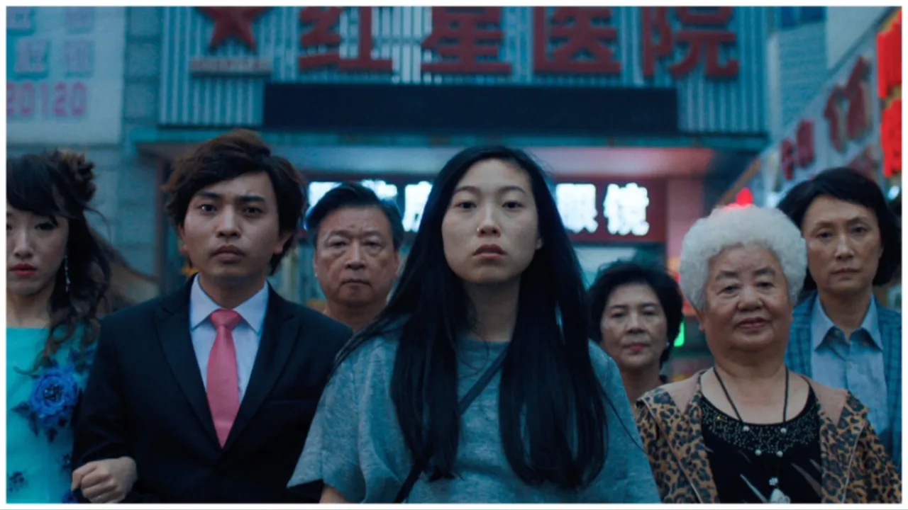 Billi (Akwafina) stands alongside her family members in a scene from 'The Farewell' (A24)