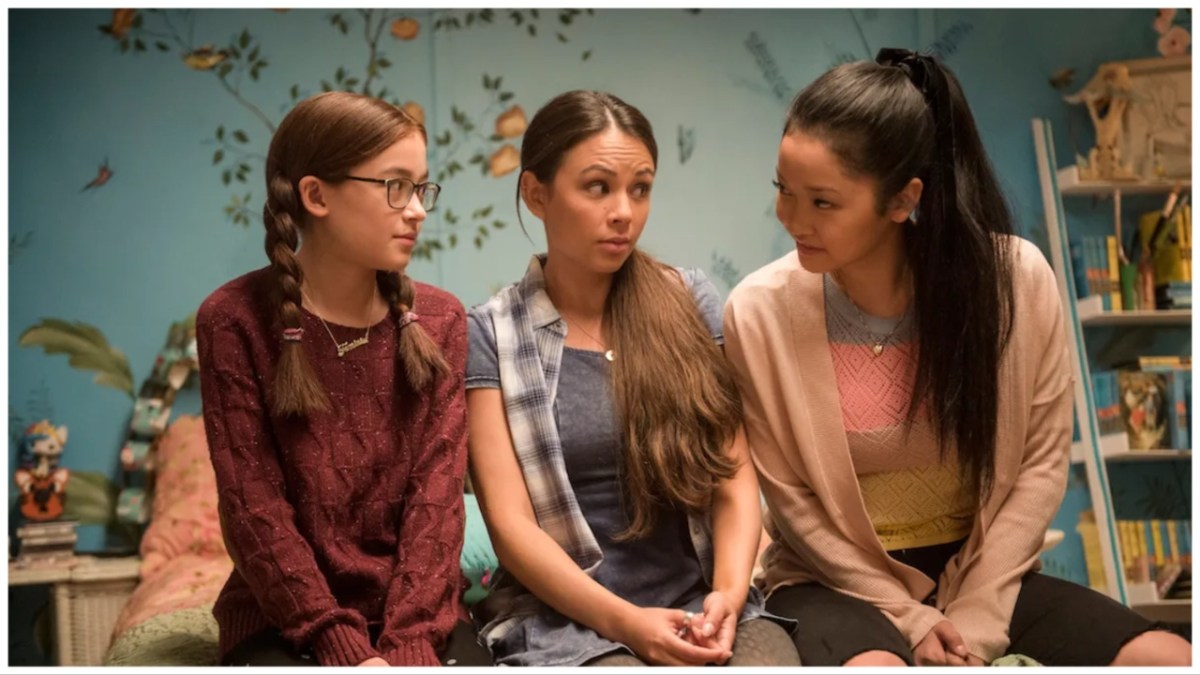 The Covey sisters sit together in To All the Boys I've Loved Before.