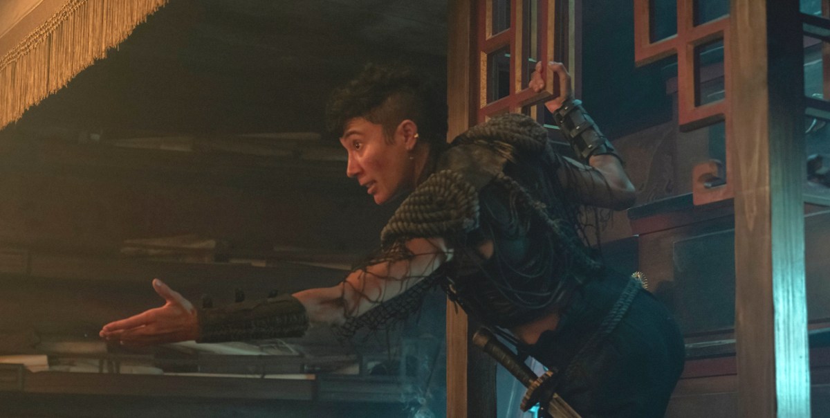 Jim holds out their hand to someone offscreen in 'Our Flag Means Death.'