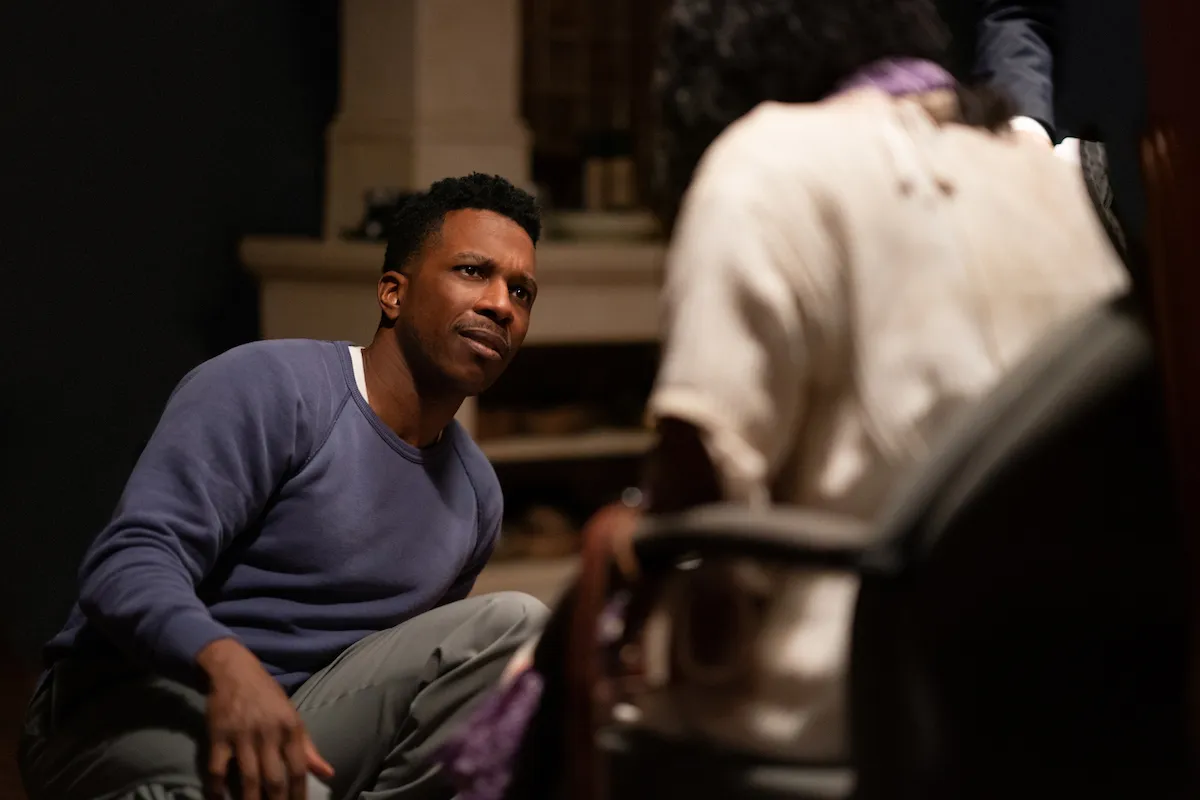 (from left) Victor Fielding (Leslie Odom, Jr.) and Angela Fielding (Lidya Jewett, back to camera) in The Exorcist: Believer, directed by David Gordon Green.
