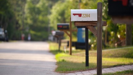 A line of mailboxes on a suburban street.