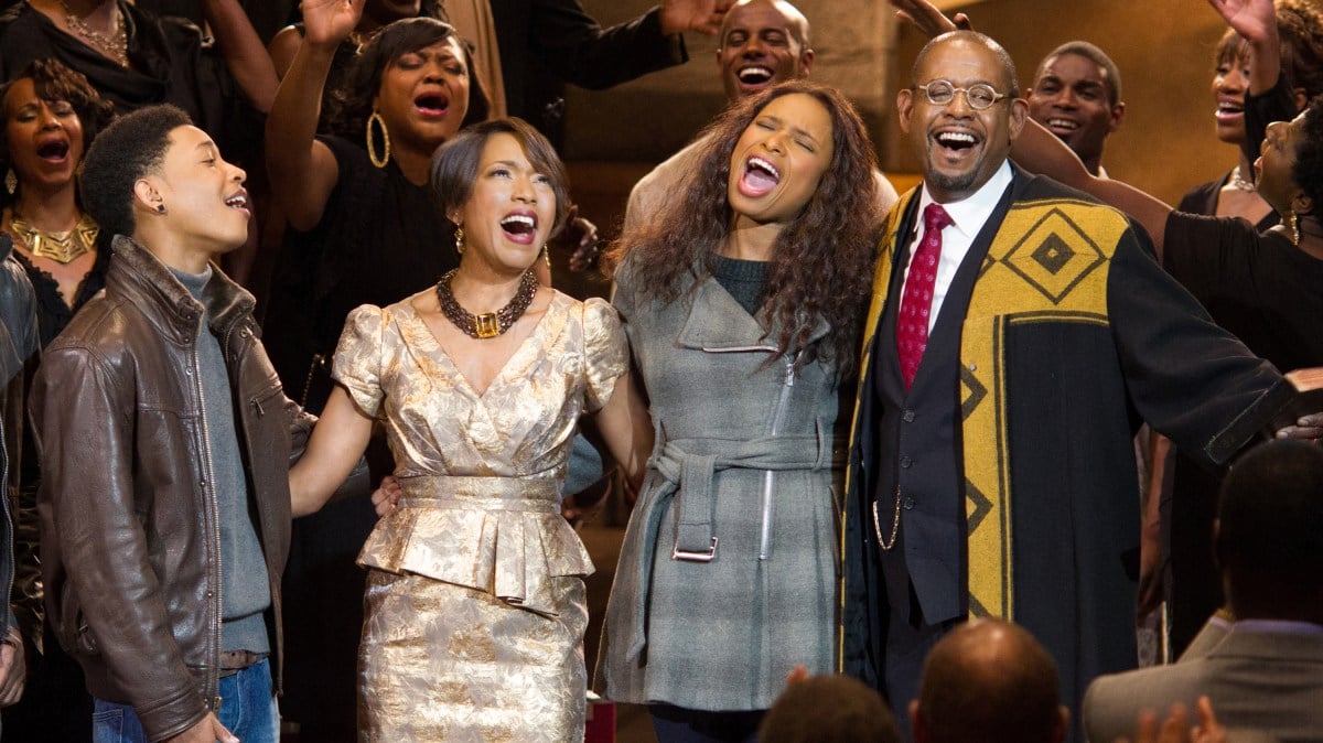 a family of four sings holiday song together in Black Nativity