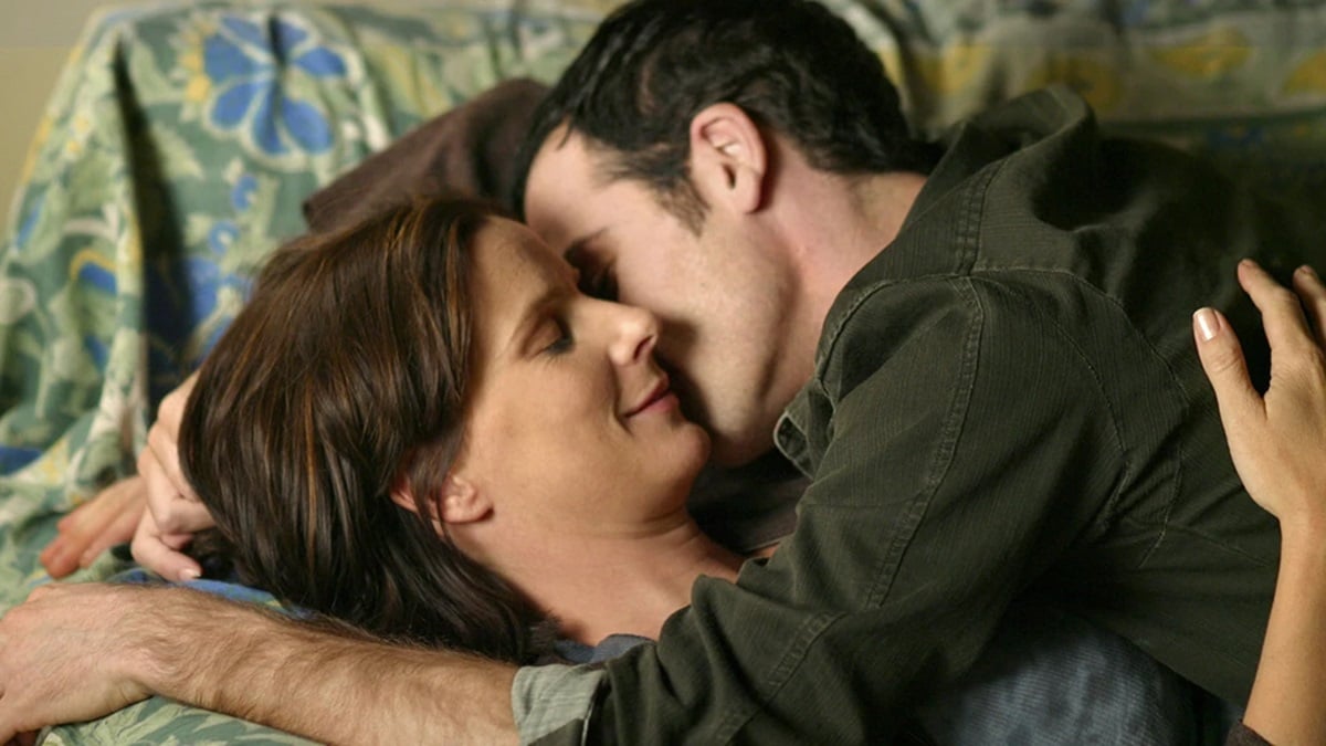 Nate and Brenda snuggle and kiss on Six Feet Under