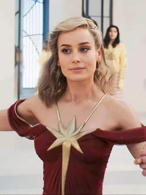 Brie Larson as Princess Carol Danvers dances in a Captain Marvel inspired ballgown in 'The Marvels'