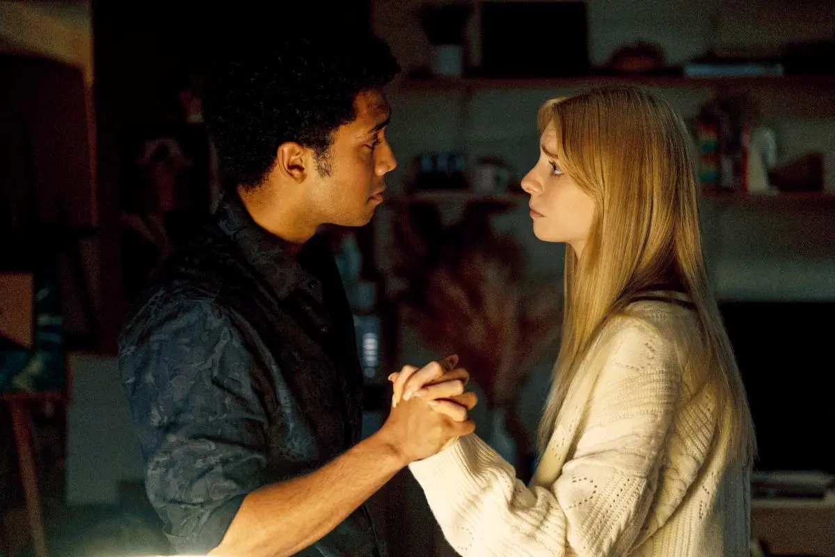 Cate (Maddie Phillips) and Andre (Chance Perdomo) hold hands in a room in 'Gen V.'