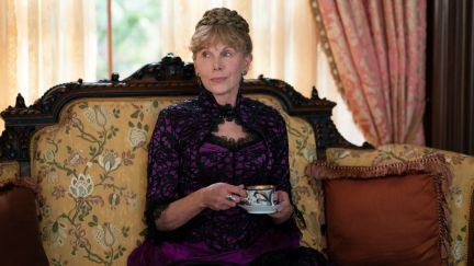 An older white woman holds a teacup and judges everyone around her in 'The Gilded Age.'