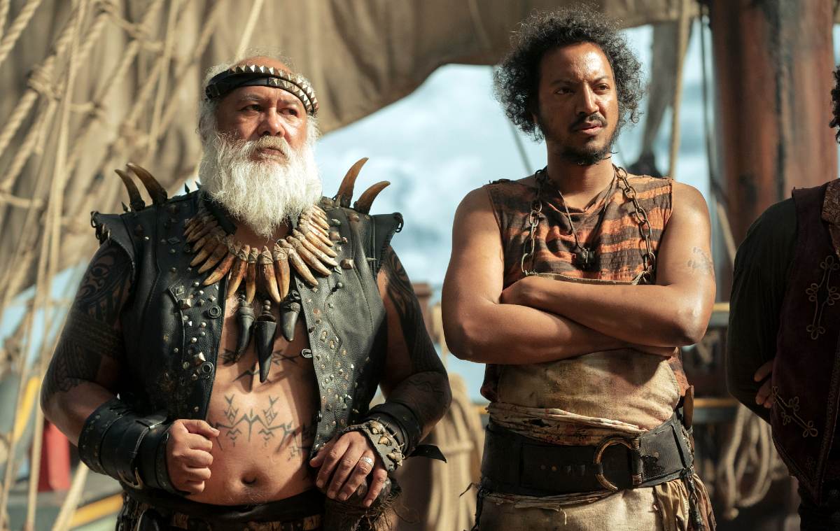Two pirates stand on the deck of a ship in 'Our Flag Means Death.'