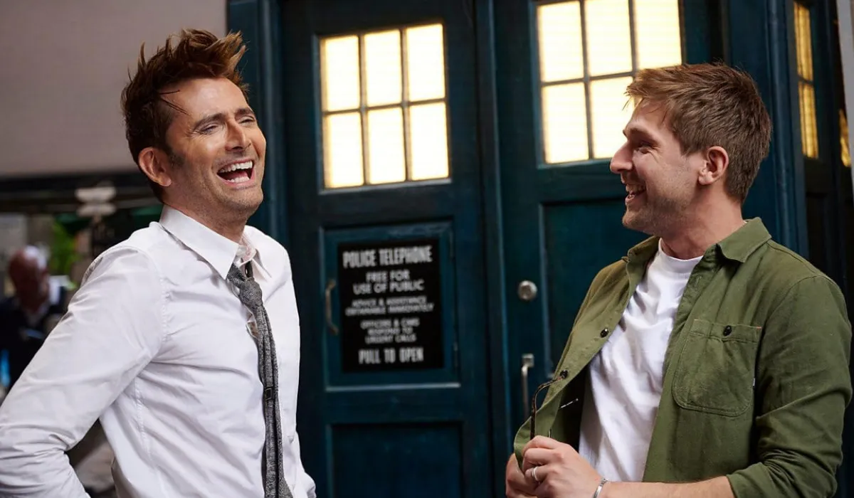 David Tenant and Steffan Powell standing in front of the Tardis in a promo image for Doctor Who: Unleashed