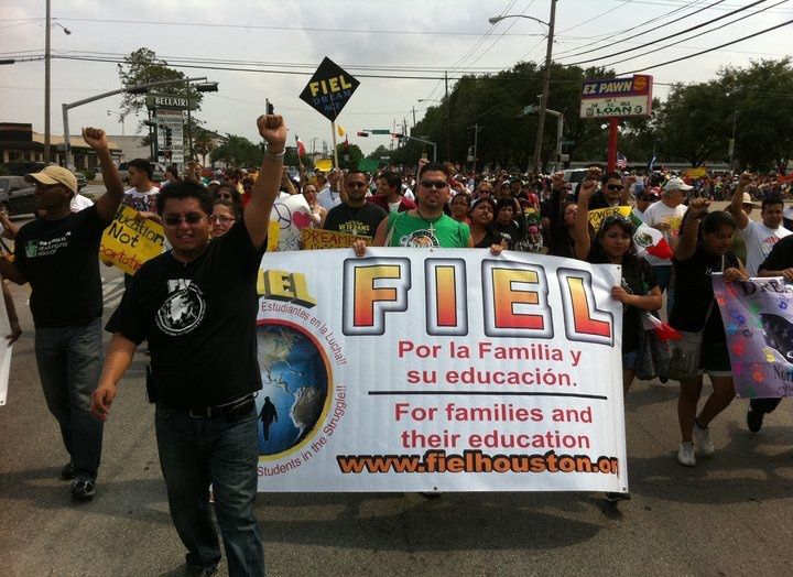 Early FIEL Houston rally with sign in English and Spanish reading "For families and their education."