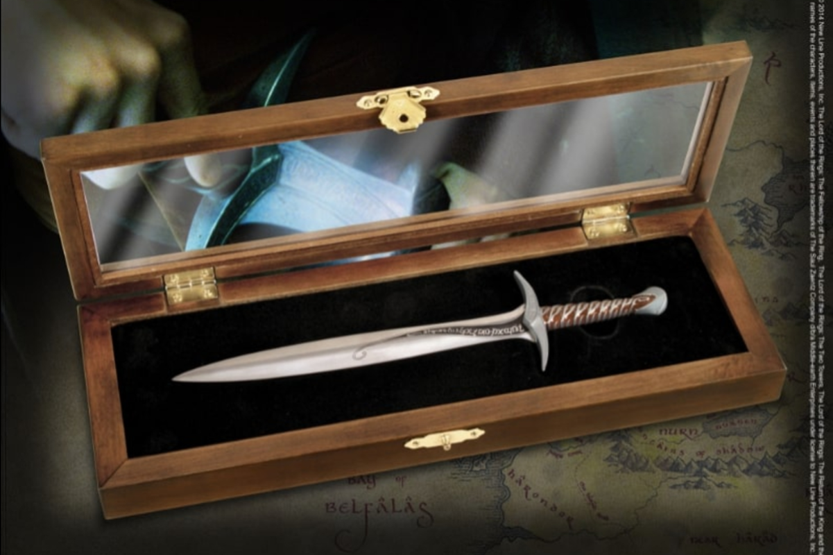 A miniature sword with a lead shaped blade in a wood and glass display case.