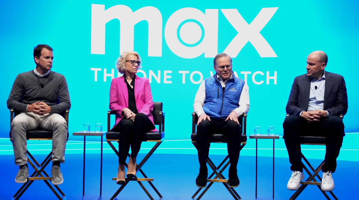 Casey Bloys, Kathleen Finch, David Zaslav, and JB Perrette sitting in front of HBO Max screen