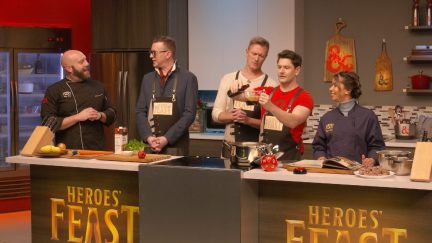 A group of people cook in a Dungeons & Dragons themed kitchen in 'Heroes' Feast.'