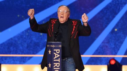 James Patterson raises his fists in celebration after accepting the Back the Blue Award at the 2023 FOX Nation Patriot Awards on Nov. 16 in Nashville, Tennessee.