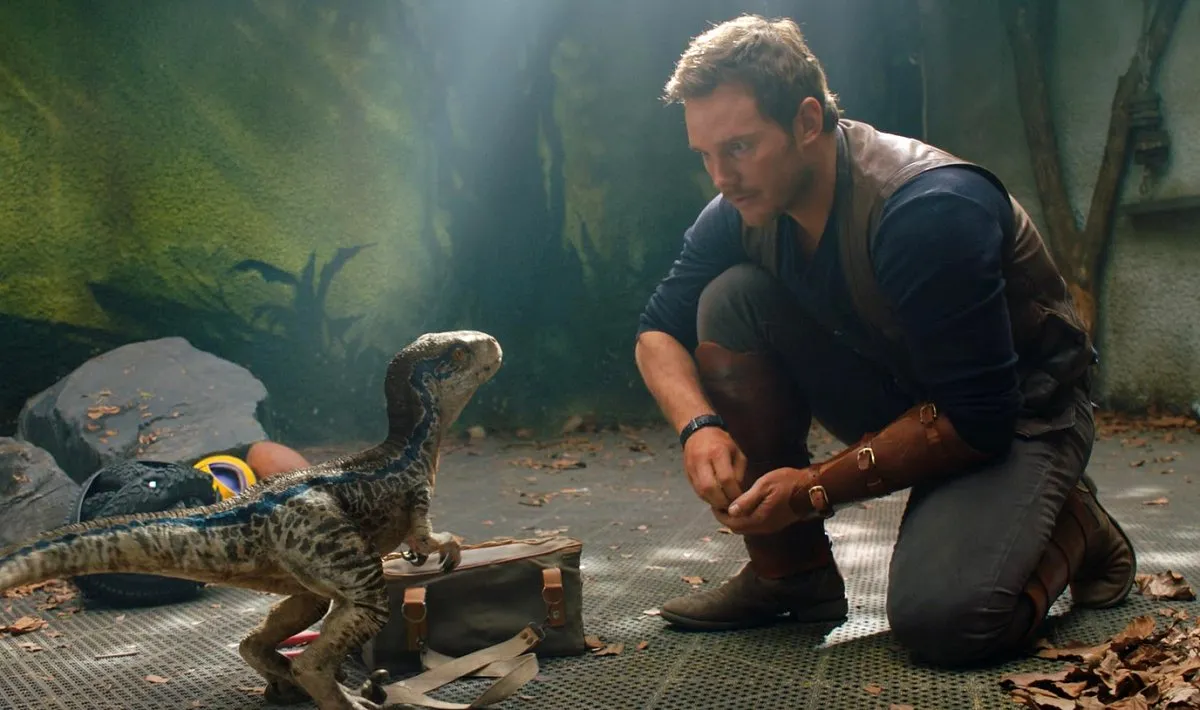 Chris Pratt and a baby dinosaur in Jurassic World: Fallen Kingdom