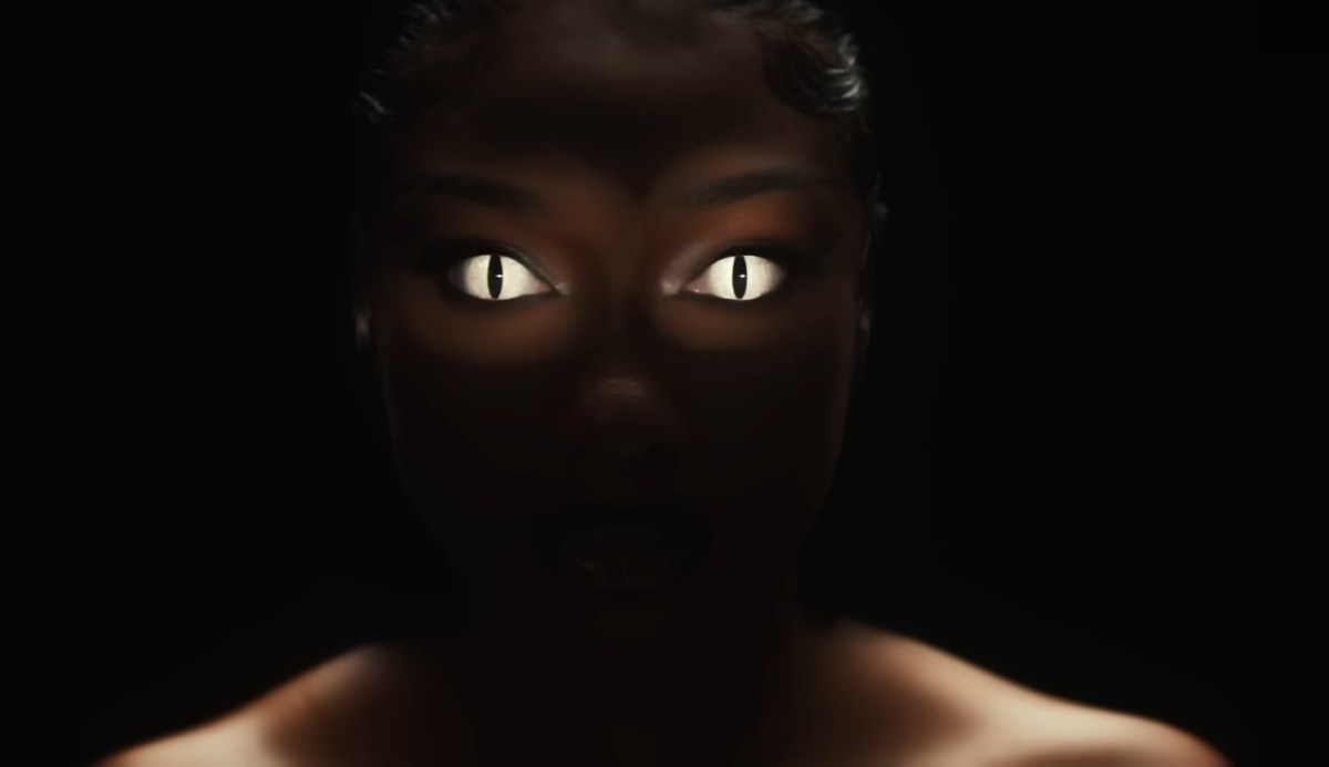 Megan Thee Stallion  with snake eyes in "Cobra." (screencap via Hot Girl Productions)