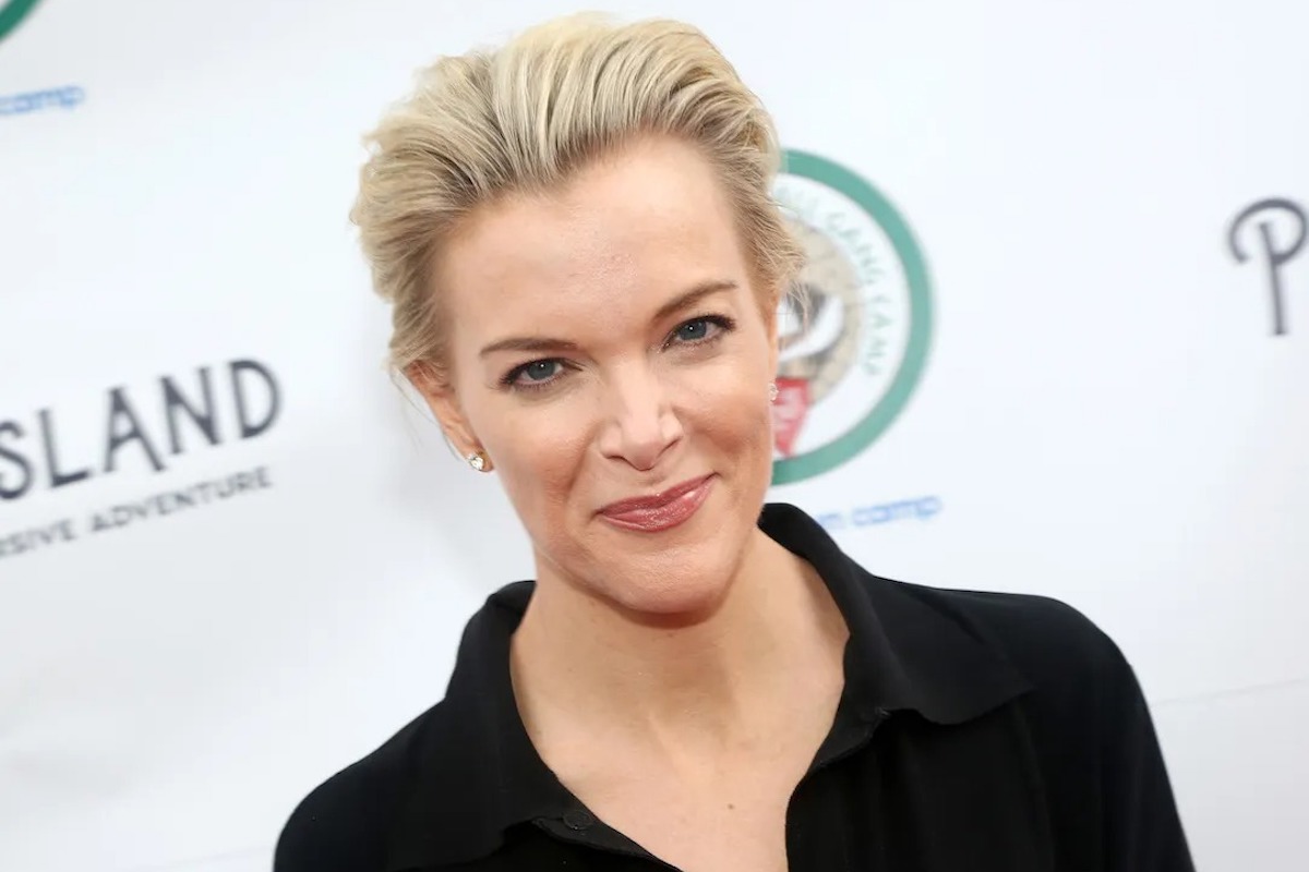 Megyn Kelly head and shoulders, black top, white background.