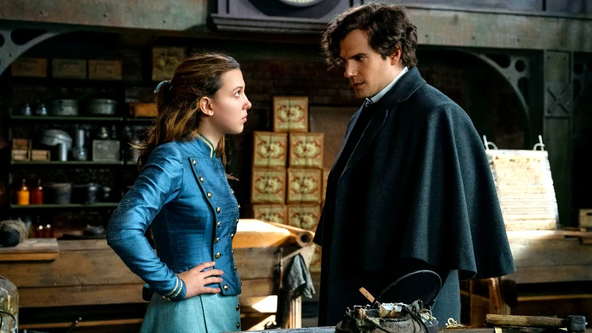 Millie Bobby Brown as Enola and Henry Cavill as Sherlock in Enola Holmes