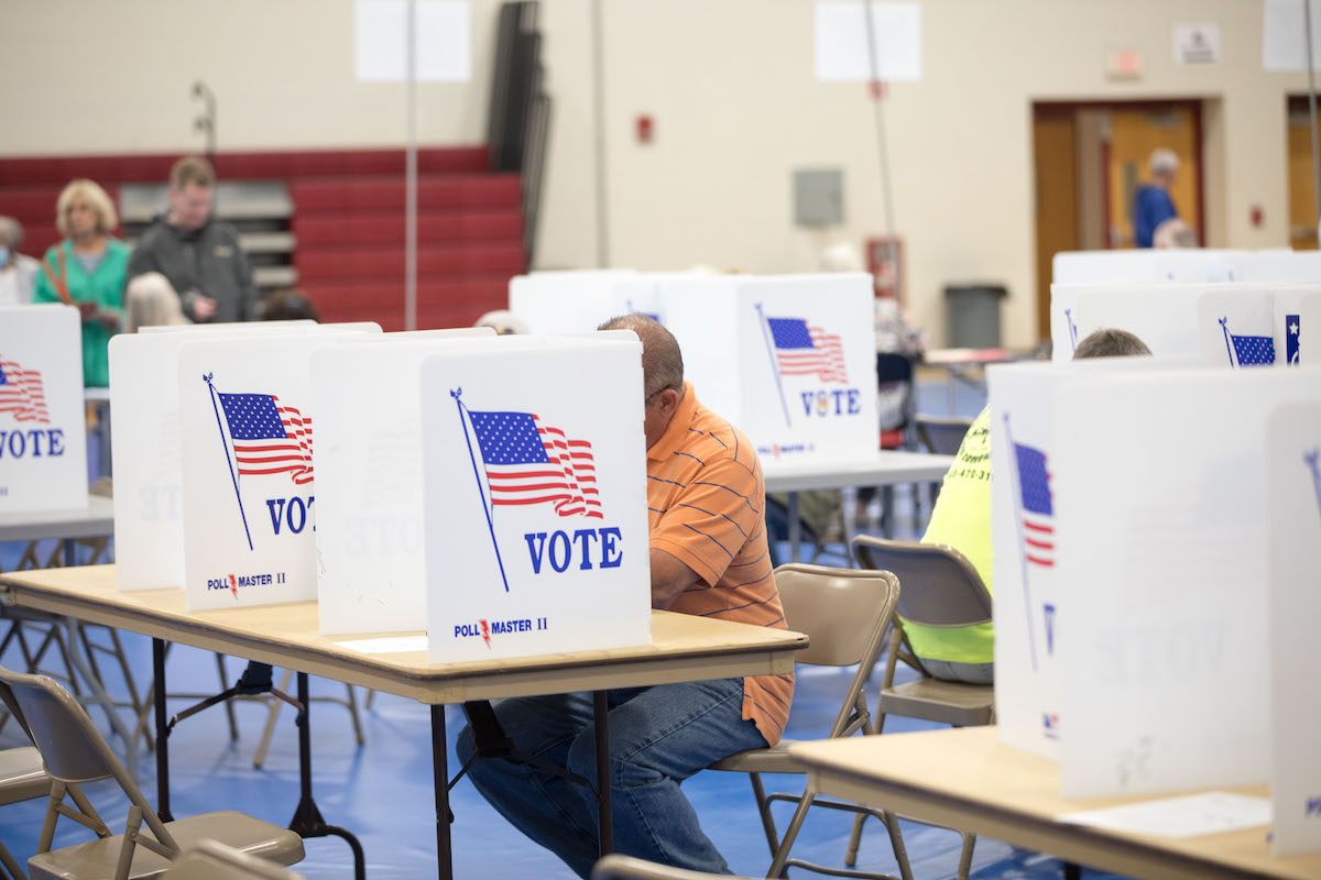 New Hampshire voter at center of a few voting booths