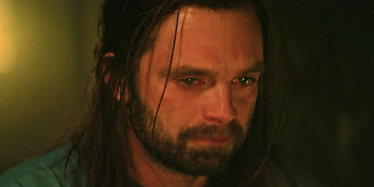 Sebastian Stan as the Winter Soldier. A man stares off with tears in his eyes.