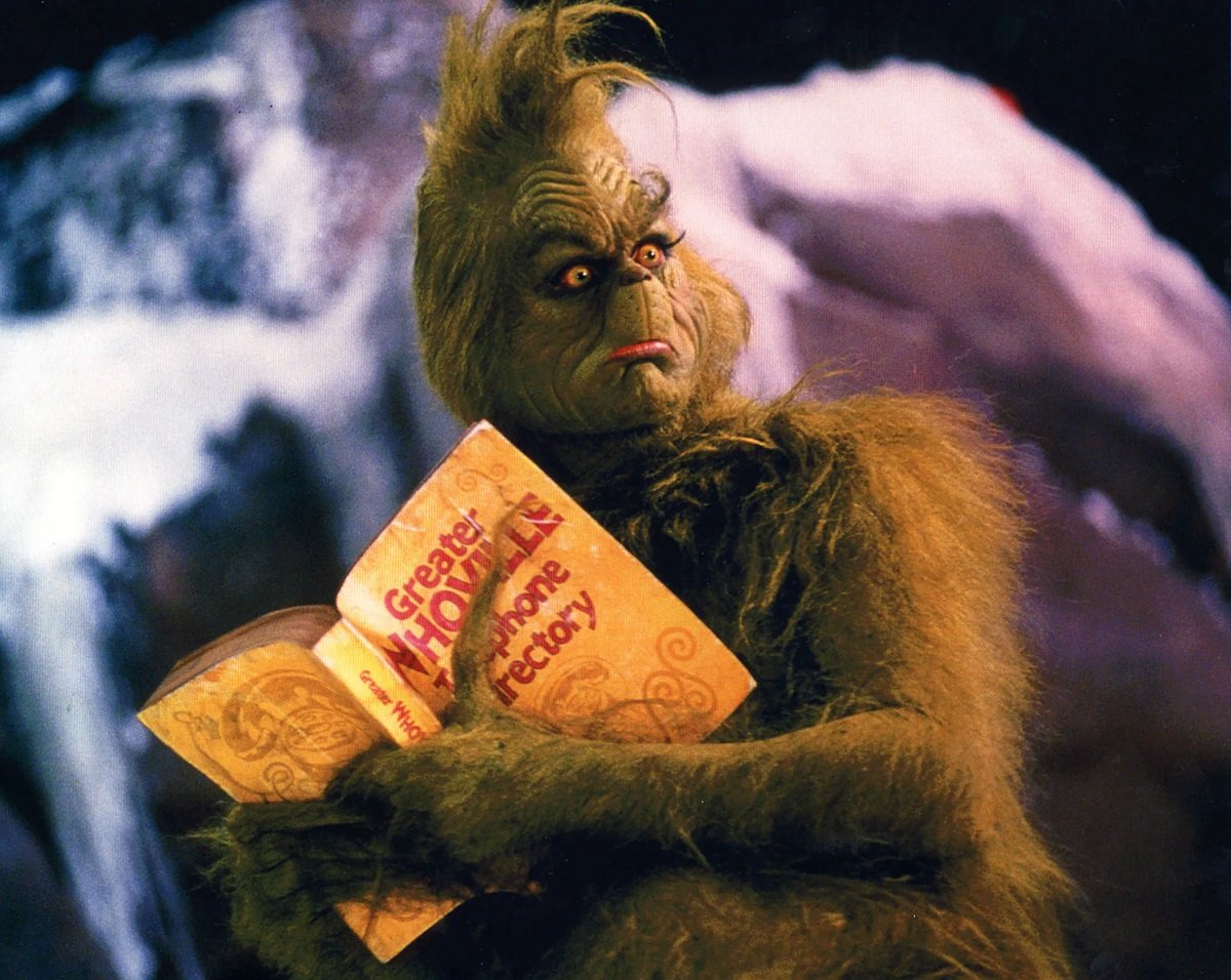 Jim Carrey as The Grinch reading the Whoville 