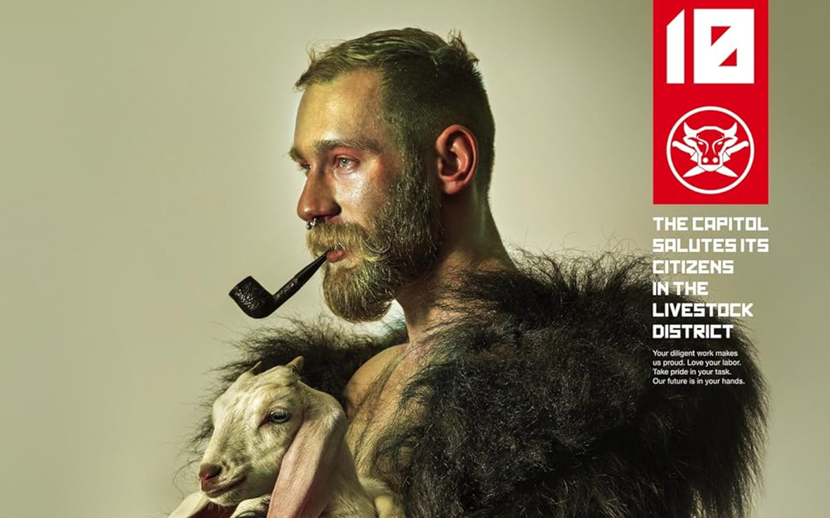 A man poses with a lamb in promotional art for 'The Hunger Games'