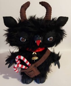 A fuzzy, goat faced figure, sticking it's tongue out and with candy canes in a belt pouch.