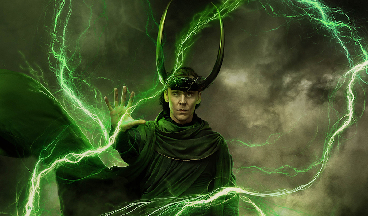Loki, wearing green robes and a black horned crown, is holding a raised hand, surrounded by green lightning.
