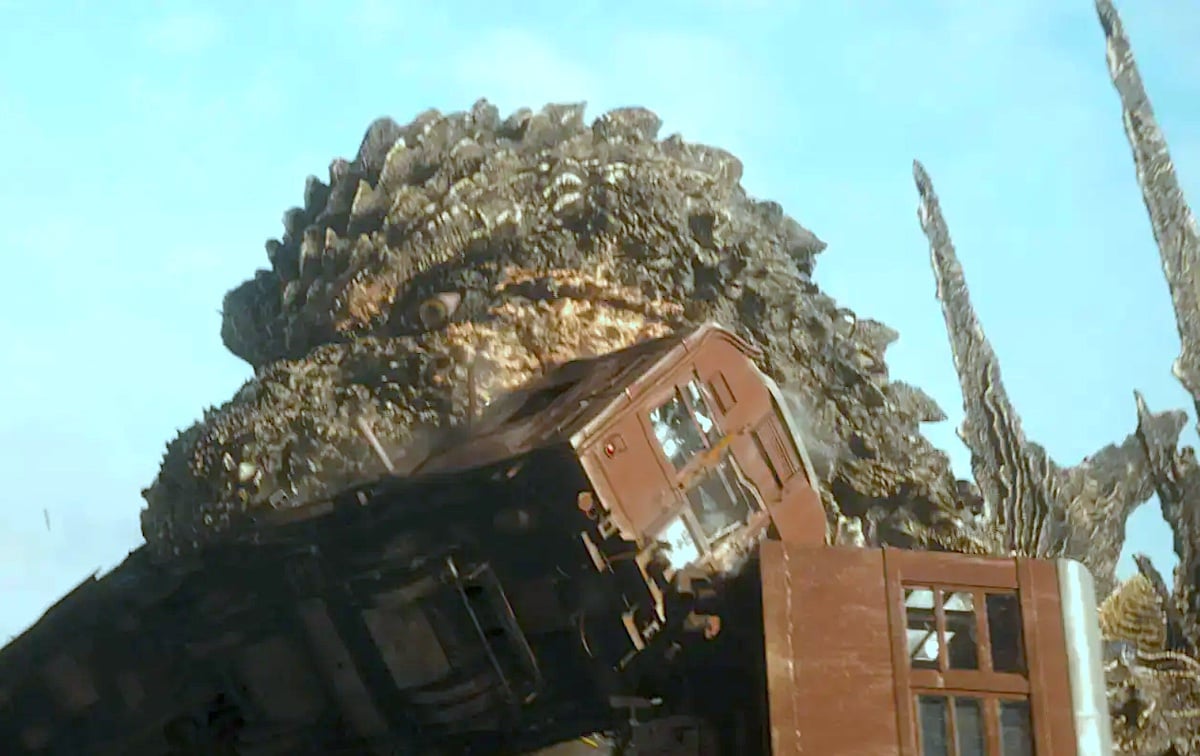 Godzilla chomps on a train in 'Godzilla Minus One'