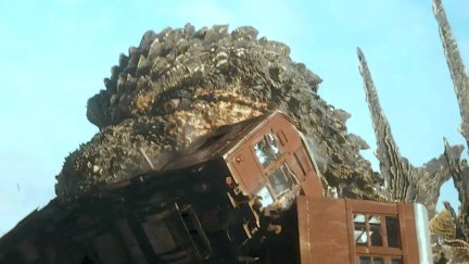 Godzilla chomps on a train in 'Godzilla Minus One'