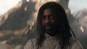 Heimdall smiles with Valhalla in the background.