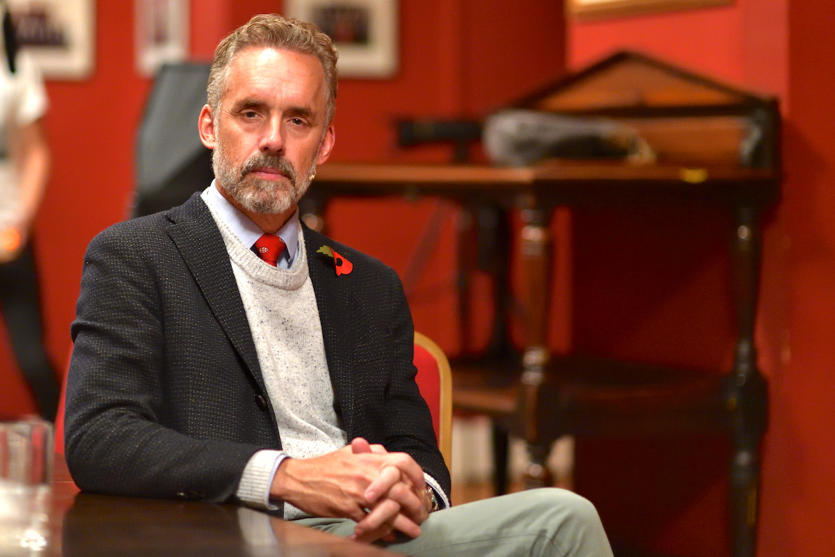 Jordan Peterson poses for a pretentious photo portrait.