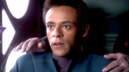 Alexander Siddig as Julian Bashir looks surprised to have Garak's hands on his shoulders on 'Star Trek: Deep Space Nine'