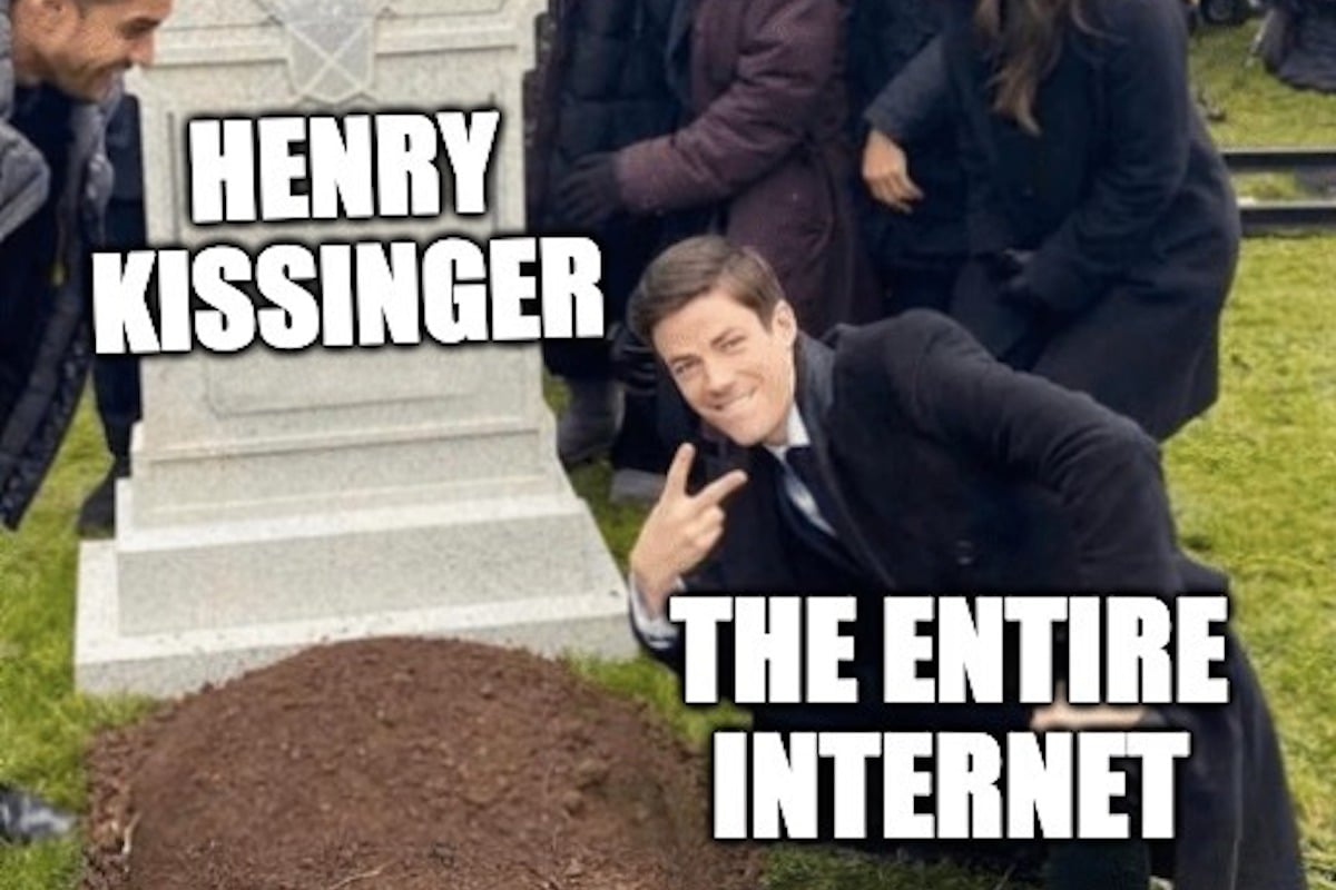 The meme of Grant Gustin (labeled The Entire Internet) flashing a peace sign over a grave (labeled "Henry Kissinger")
