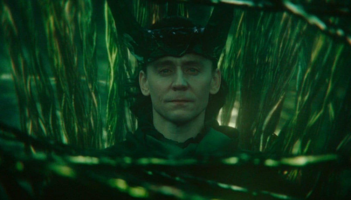 Loki wears a new crown of horns, surrounded by the green threads of time.