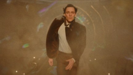 Loki walks on the gangway to the temporal loom with no radiation suit on.