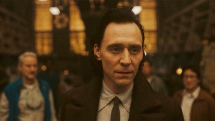 Tom Hiddleston as Loki standing with the team at the end of Loki season 2, episode 5.