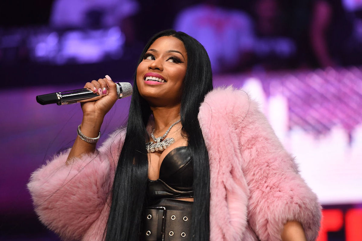 Nicki Minaj smiles coyly while performing