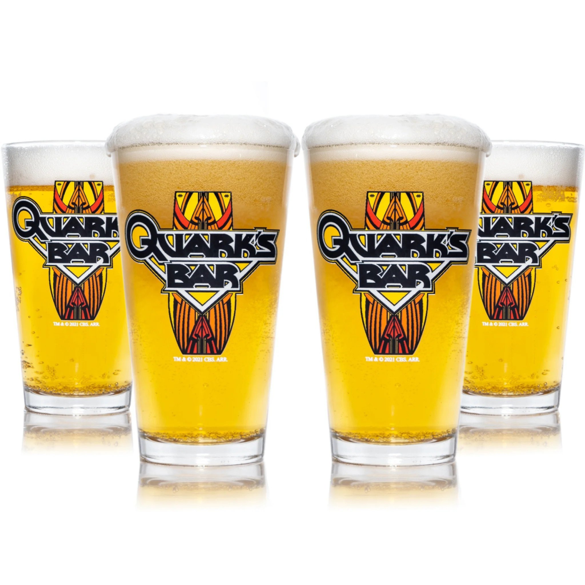Four pint glasses filled with beer that have the logo for Quark's Bar on them.