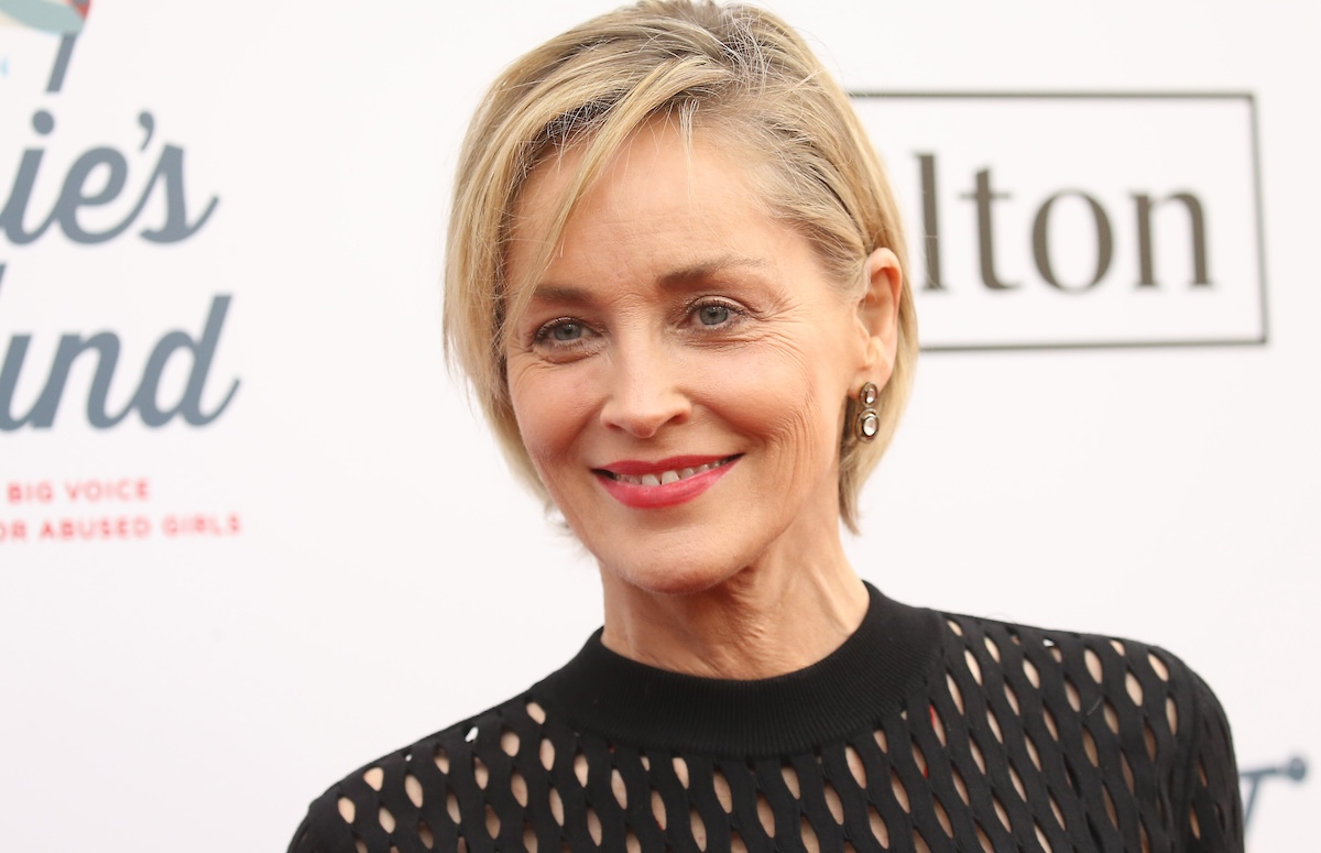 Sharon Stone smiles on a red carpet.