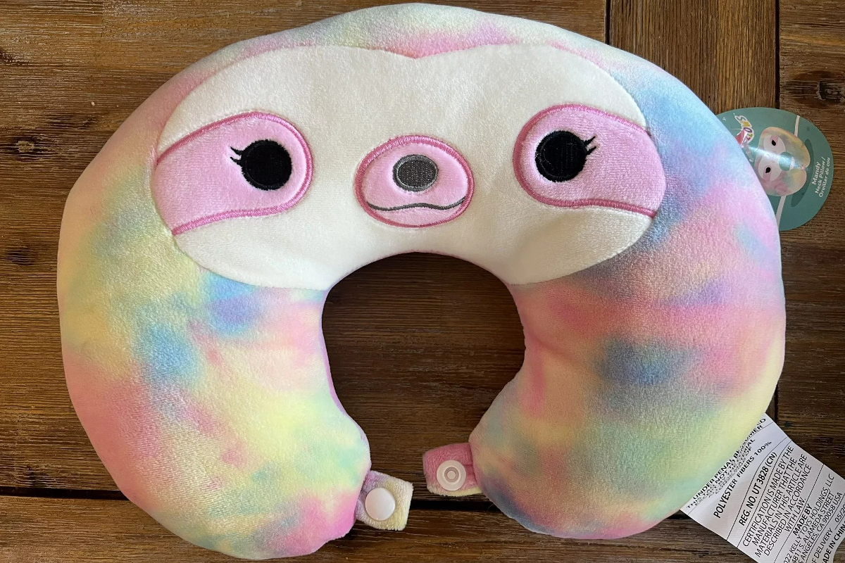 Rainbow sloth Squishmallow neck pillow.