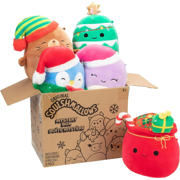 Four Christmas themed Squishmallows, including a present sack and four characters in Santa or elf hats, poking out of and in front of a cardboard box.