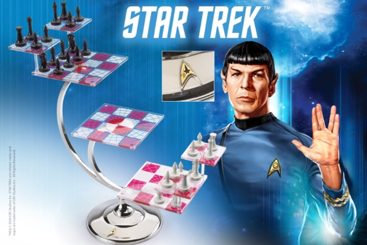 An image of seven connected chess boards set up on different levels. Spock is posed to the side in his blue uniform, making the Vulcan hand sign.