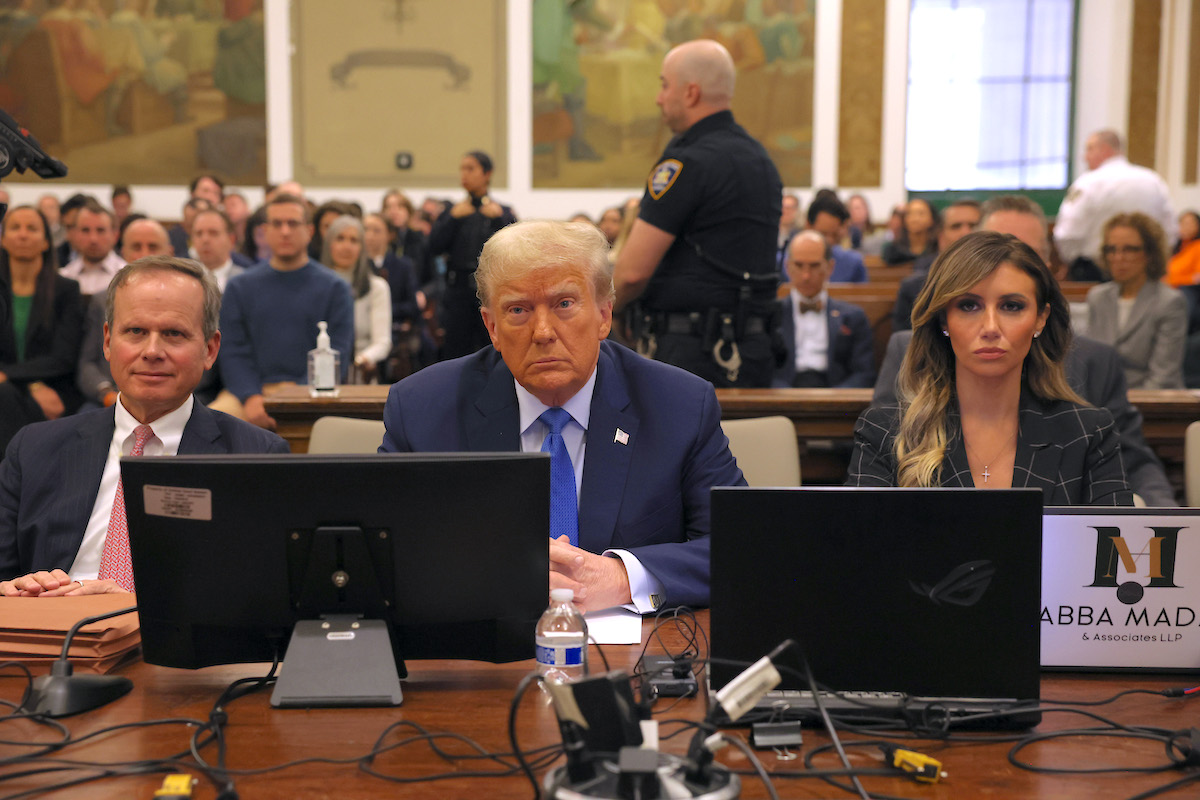Donald Trump sits in the courtroom with attorneys