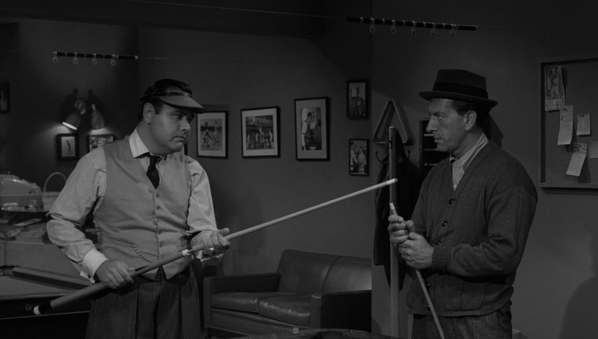 Two men play pool looking serious in the Twilight Zone episode A Game of Pool