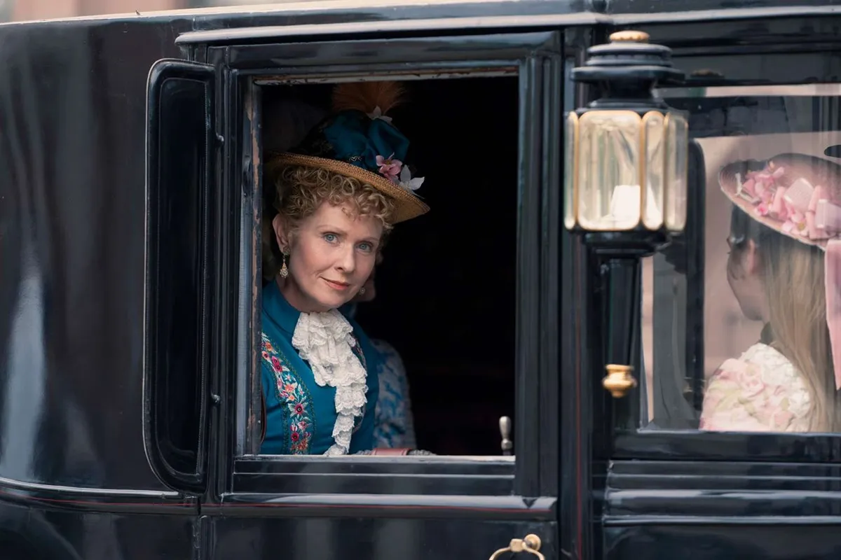 Cynthia Nixon as Ada peeking out of a carriage window in The Gilded Age season 2