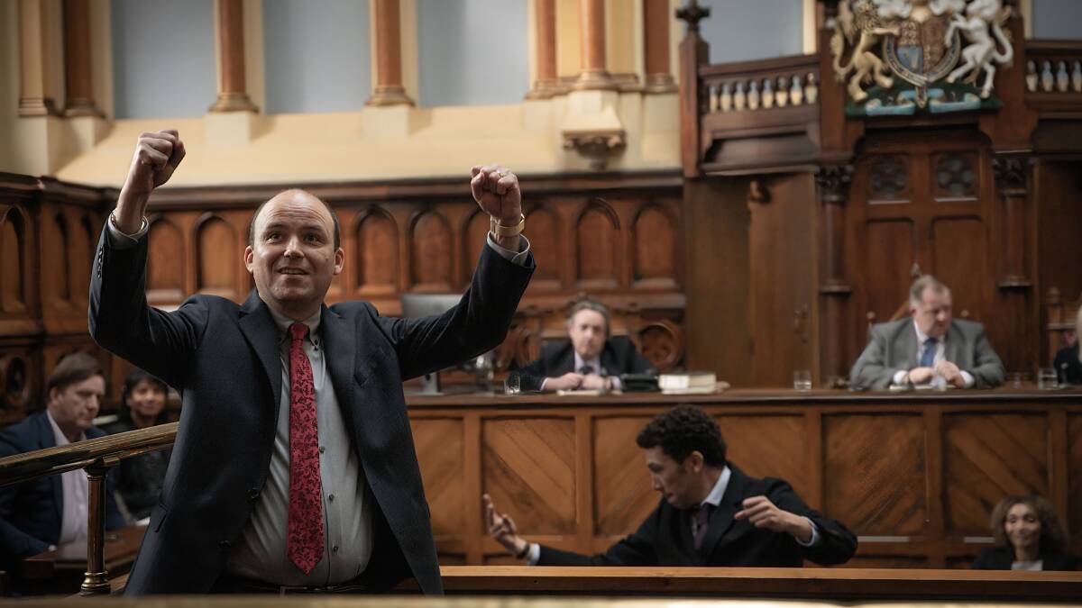 Joel Fry with hands in the air after winning in court in Bank of Dave