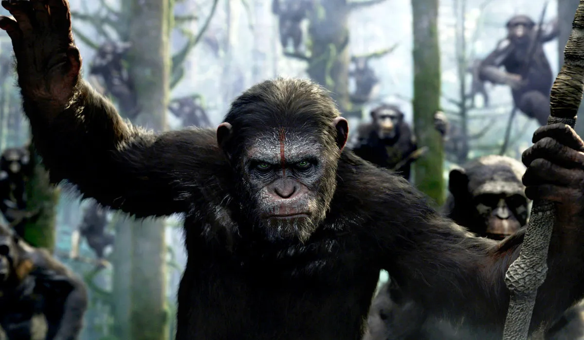 Caesar leads an army of apes in a forest in Dawn of the Planet of the Apes