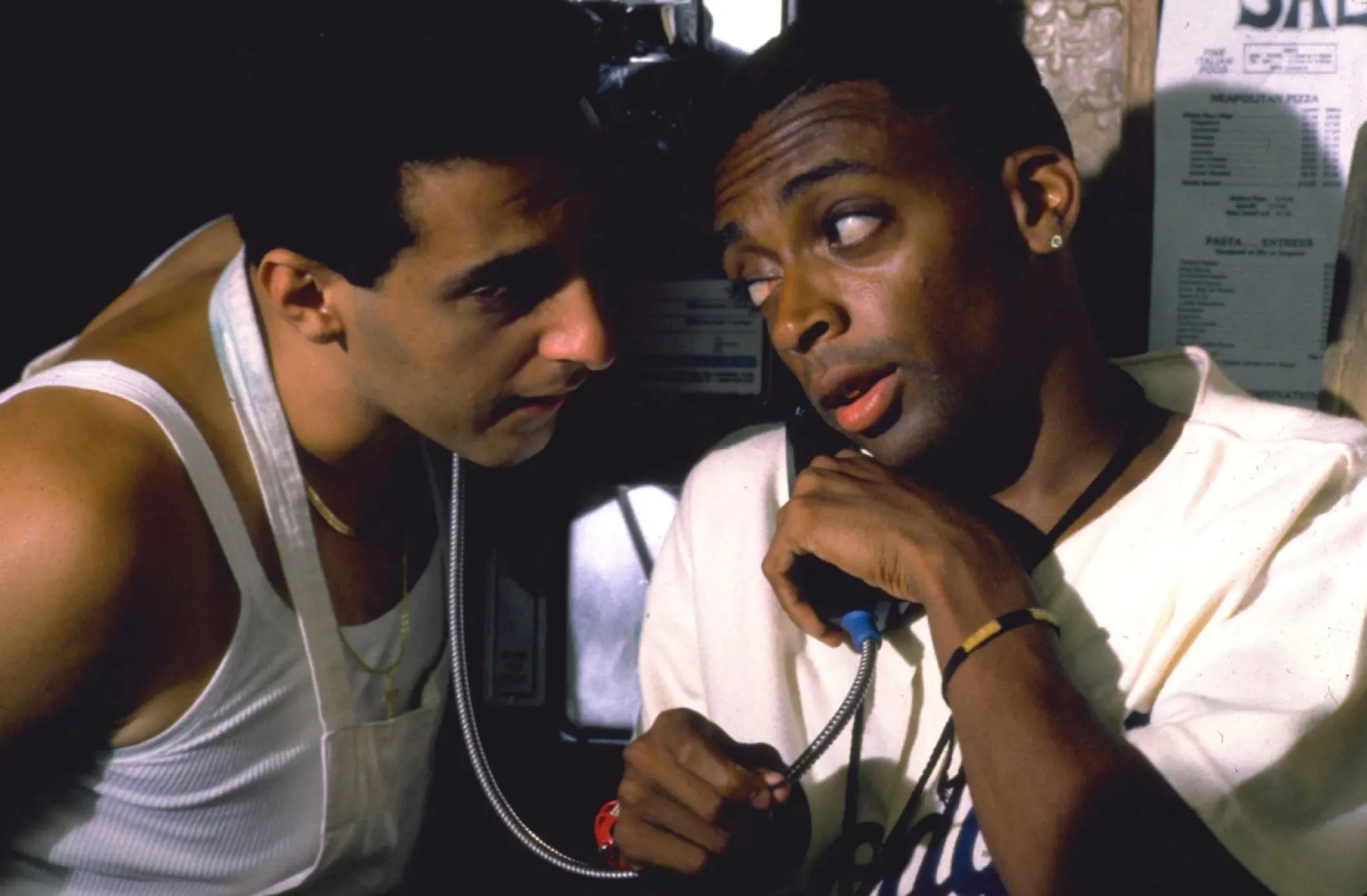Pino (John Turturro) and Mookie (Spike Lee) talking in the pizzeria in "Do The Right Thing." 