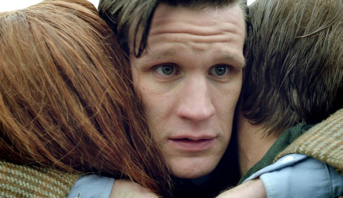 The Eleventh Doctor (Matt Smith) hugging the Ponds (Karen Gillan and Arthur Darvill)