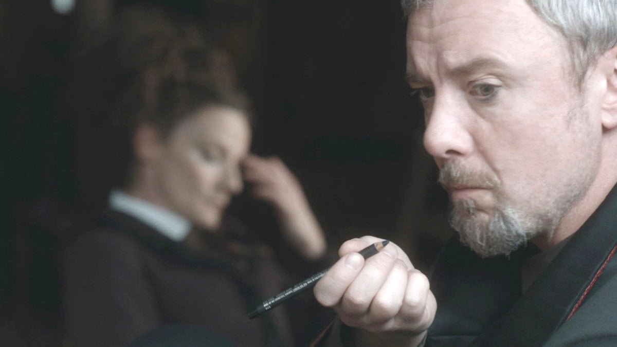 John Simm as the Master, with Michelle Gomez's Missy in the background